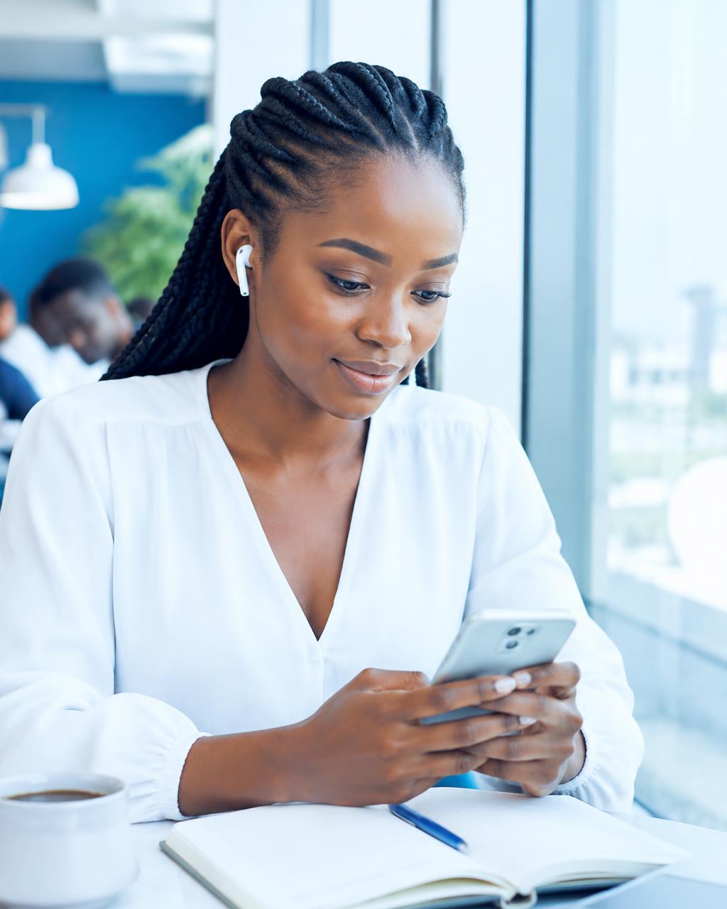 Learner following a lesson on her phone